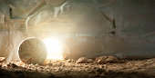 Jesus Christ resurrection. Christian Easter concept. Empty tomb of Jesus with light. Born to Die, Born to Rise. 