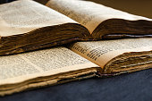 Jewish Bible. An open old Jewish books. Opened scripture pages. Selective focus. Closeup of hebrew text