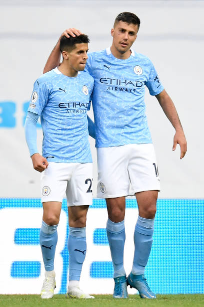 Joao Cancelo of Manchester City celebrates with Rodrigo after scoring their side's first goal during the Premier League match between Newcastle...