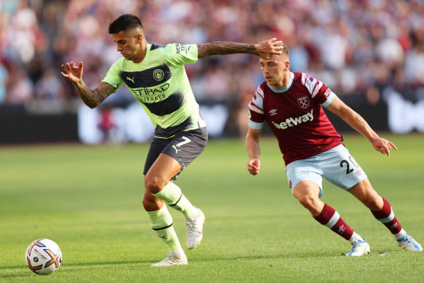 Joao Cancelo of Manchester City is put under pressure by Jarrod Bowen of West Ham United during the Premier League match between West Ham United and...