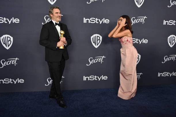 Joaquin Phoenix and Sarah Hyland attend the 21st Annual Warner Bros And InStyle Golden Globe After Party at The Beverly Hilton Hotel on January 05...