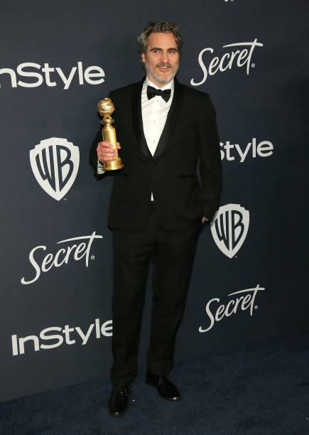 Joaquin Phoenix poses for a photo with his award for Best Performance by an Actor in a Motion Picture Drama at the 21st Annual Warner Bros And...
