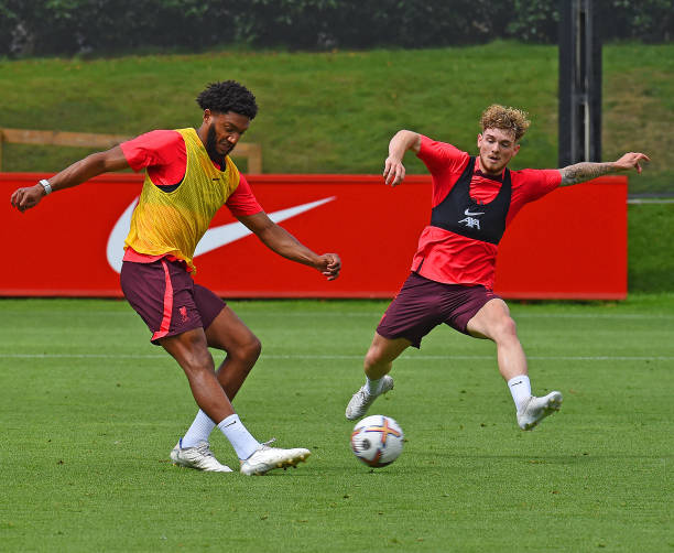 Joe Gomez of Liverpool with Harvey Elliott of Liverpool during a training session at AXA Training Centre on August 04, 2022 in Kirkby, England.