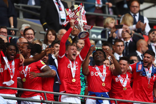 Joe Worrall of Nottingham Forest lifts the trophy following their team's victory in the Sky Bet Championship Play-Off Final match between...