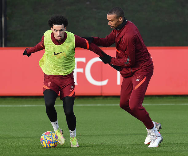 Joel Matip of Liverpool with Curtis Jones of Liverpool during a training session at AXA Training Centre on December 24, 2021 in Kirkby, England.