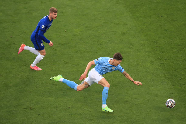 John Stones of Manchester City chases down the ball under pressure from Timo Werner of Chelsea during the UEFA Champions League Final between...