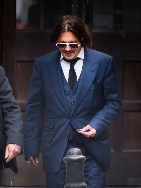 Johnny Depp leaves the Royal Courts of Justice Strand on July 07 2020 in London England The American actor is taking News Group Newspapers publishers...
