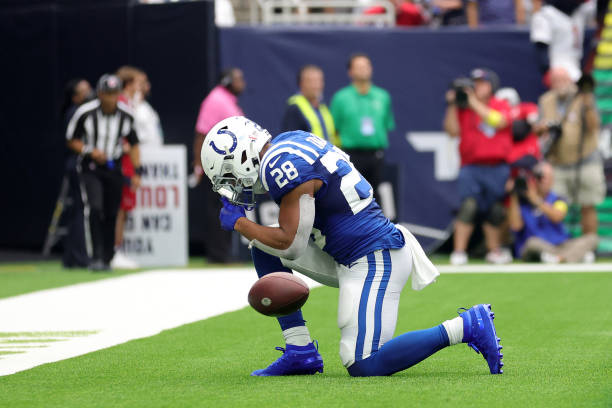 Jonathan Taylor of the Indianapolis Colts celebrates scoring a touchdown during the fourth quarter against the Houston Texans at NRG Stadium on...