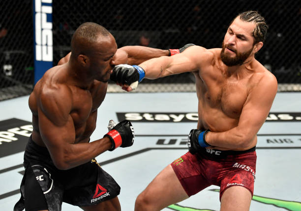 Jorge Masvidal punches Kamaru Usman of Nigeria in their UFC welterweight championship fight during the UFC 251 event at Flash Forum on UFC Fight...