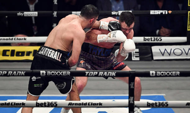 Josh Taylor is caught by a punch from Jack Catterall during the WBA, WBC, WBO & IBF world super-lightweight title fight at the OVO Hydro, on February...