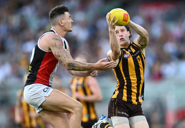 Josh Ward of the Hawks marks infront of Josh Battle of the Saints during the round four AFL match between the Hawthorn Hawks and the St Kilda Saints...