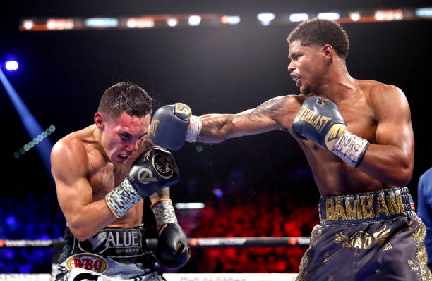 Junior lightweight champion Shakur Stevenson punches WBC champion Oscar Valdez during a title unification fight at MGM Grand Garden Arena on April...