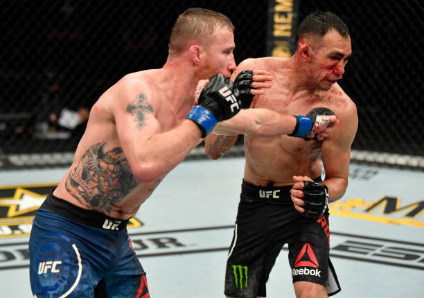 Justin Gaethje punches Tony Ferguson in their UFC interim lightweight championship fight during the UFC 249 event at VyStar Veterans Memorial Arena...