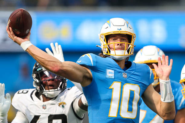 Justin Herbert of the Los Angeles Chargers attempts a pass during the second half against the Jacksonville Jaguars at SoFi Stadium on September 25,...