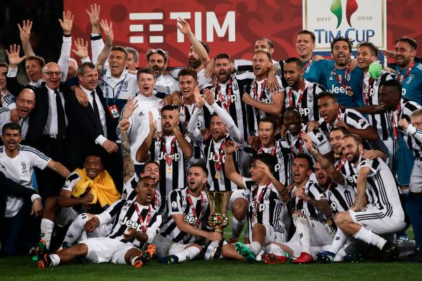 juventus-players-pose-with-the-trophy-after-winning-the-italian-tim-picture-id956636574