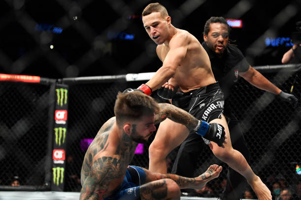 Kai Kara-France of New Zealand knocks out Cody Garbrandt in their flyweight bout during the UFC 269 on December 11, 2021 in Las Vegas, Nevada.