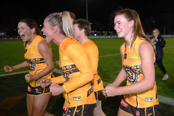 Kaitlyn Ashmore and Aileen Gilroy of the Hawks celebrate victory following the round five AFLW match between the Sydney Swans and the Hawthorn Hawks...