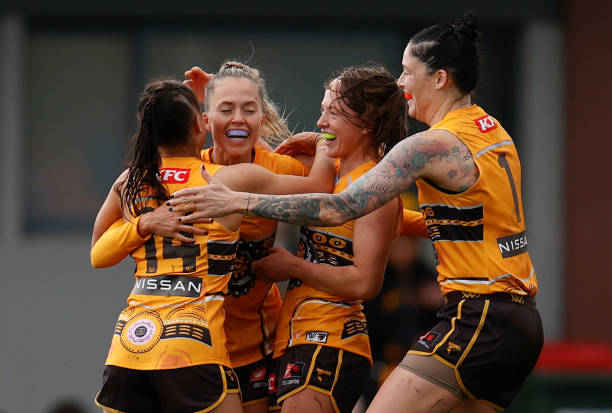 Kaitlyn Ashmore of the Hawks celebrates a goal with teammates during the 2022 S7 AFLW Round 04 match between the Hawthorn Hawks and the Carlton Blues...