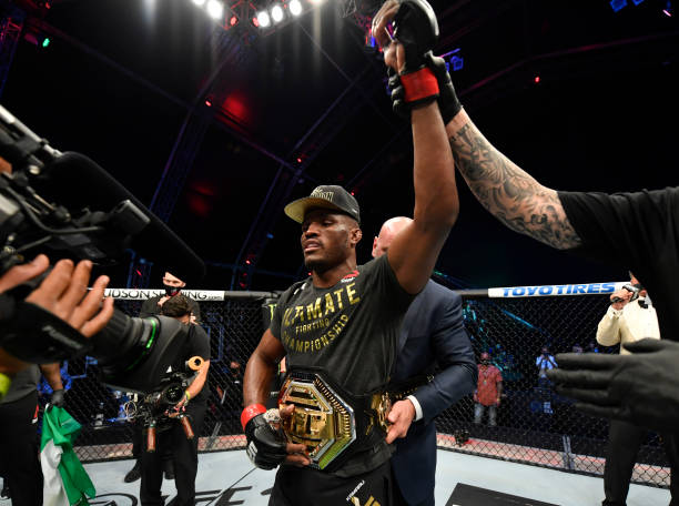 Kamaru Usman of Nigeria celebrates after his victory over Jorge Masvidal in their UFC welterweight championship fight during the UFC 251 event at...