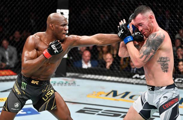Kamaru Usman of Nigeria punches Colby Covington in their UFC welterweight championship fight during the UFC 268 event at Madison Square Garden on...