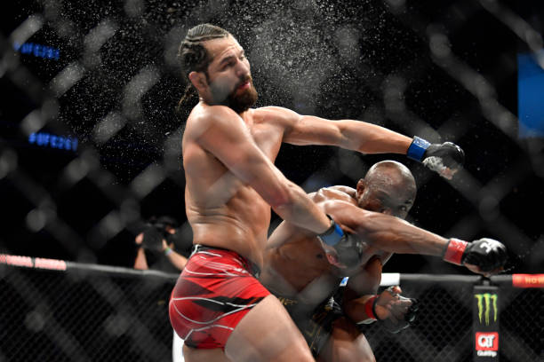 Kamaru Usman of Nigeria punches Jorge Masvidal in their UFC welterweight championship bout during the UFC 261 event at VyStar Veterans Memorial Arena...