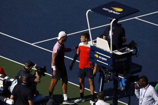 Karen Khachanov talks with Jack Draper of Great Britain after Draper retired during their Men's Singles Third Round match on Day Five of the 2022 US...