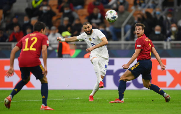 Karim Benzema of France scores their side's first goal whilst under pressure from Cesar Azpilicueta of Spain during the UEFA Nations League 2021...