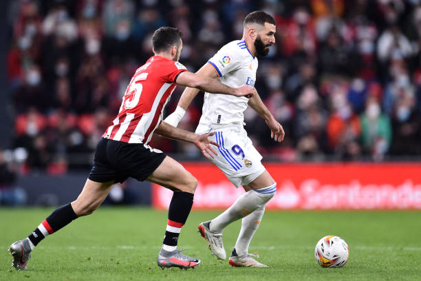 Karim Benzema of Real Madrid battles for the ball with Inigo Lekue of Athletic Bilbao during the LaLiga Santander match between Athletic Club and...