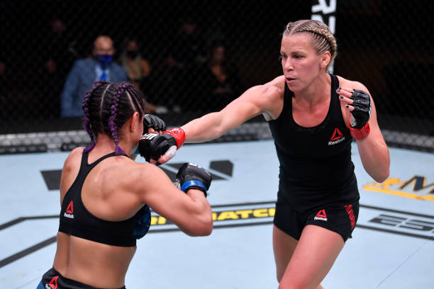 Katlyn Chookagian punches Cynthia Calvillo in their women's flyweight bout during the UFC 255 event at UFC APEX on November 21, 2020 in Las Vegas,...