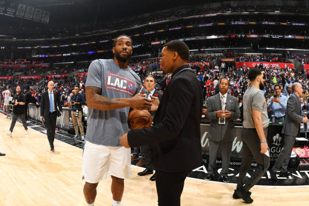 Kawhi Leonard of the LA Clippers and Kyle Lowry of the Toronto Raptors speak during halftime of the game on November 11, 2019 at STAPLES Center in...