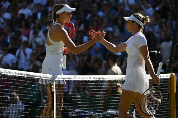 Kazakhstan's Elena Rybakina shakes hands with Romania's Simona Halep after winning at the end of their women's singles semi final tennis match on the...