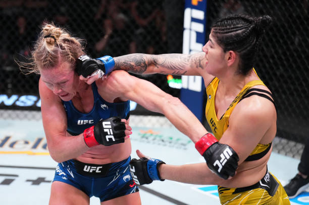 Ketlen Vieira of Brazil punches Holly Holm in a bantamweight bout during the UFC Fight Night event at UFC APEX on May 21, 2022 in Las Vegas, Nevada.