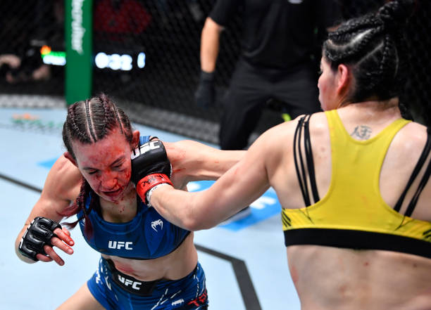 Ketlen Vieira of Brazil punches Miesha Tate in a bantamweight fight during the UFC Fight Night event at UFC APEX on November 20, 2021 in Las Vegas,...