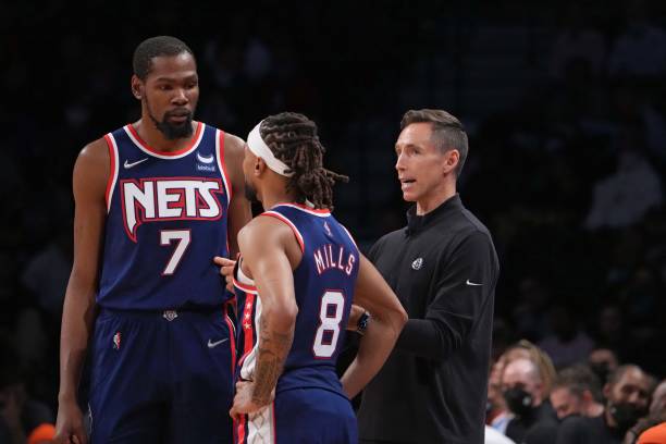 Kevin Durant of the Brooklyn Nets, Patty Mills of the Brooklyn Nets and Head Coach Steve Nash of the Brooklyn Nets talk during a game on November 16,...