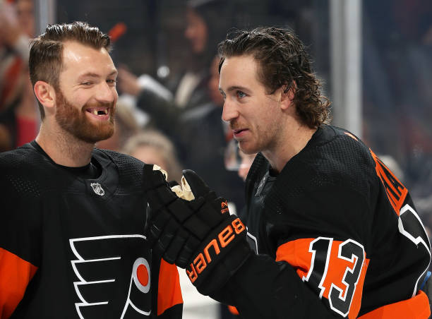 Kevin Hayes and Sean Couturier of the Philadelphia Flyers exchange a laugh during warms up against the Toronto Maple Leafs on November 2, 2019 at the...