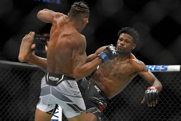 Kevin Holland and Alex Oliveira of Brazil battle in their welterweight fight during UFC 272 at T-Mobile Arena on March 05, 2022 in Las Vegas, Nevada.