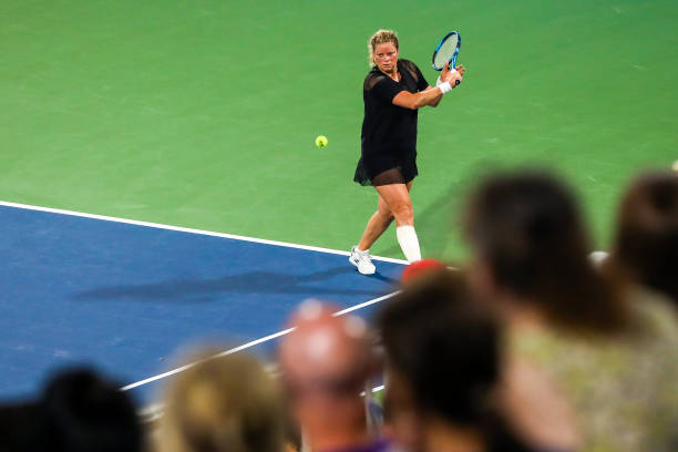 Kim Clijsters hits a return against Sloane Stephens during the Truist Atlanta Open at Atlantic Station on July 26, 2021 in Atlanta, Georgia.