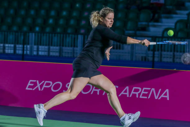 Kim Clijsters of Belgium in action against Caroline Wozniacki of Denmark during Expo 2020 Dubai Tennis Week at the Expo Sports Arena in Dubai, United...