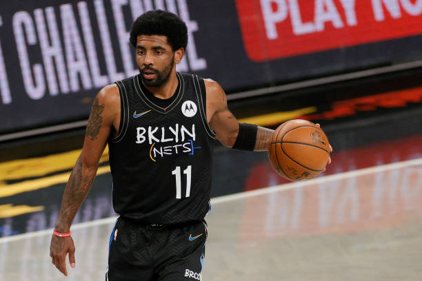 Kyrie Irving of the Brooklyn Nets dribbles during the second half of Game Two of their Eastern Conference first-round playoff series against the...