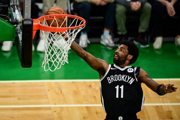 Kyrie Irving of the Brooklyn Nets drives to the basket against the Boston Celtics during Game Four of the Eastern Conference first round series at TD...