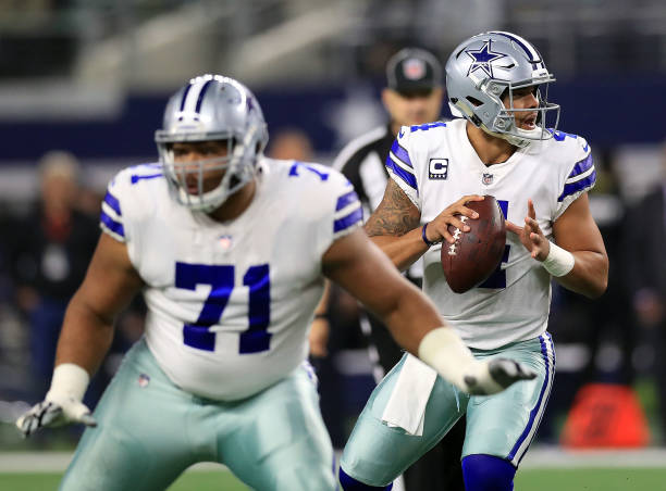 La'el Collins of the Dallas Cowboys protects Dak Prescott of the Dallas Cowboys who looks to pass int he first quarter of a football game against the...