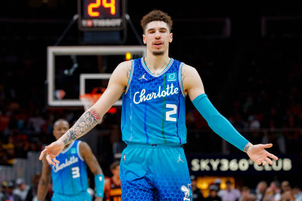 LaMelo Ball of the Charlotte Hornets reacts during the second half against the Atlanta Hawks at State Farm Arena on April 13, 2022 in Atlanta,...