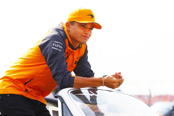 Lando Norris of Great Britain and McLaren looks on from the drivers parade prior to the F1 Grand Prix of The Netherlands at Circuit Zandvoort on...