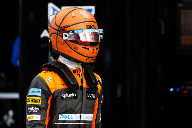Lando Norris of Great Britain and McLaren walks in the Pitlane after crashing out of the race during the F1 Grand Prix of Miami at the Miami...