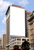 Large blank billboard on the side of a city building