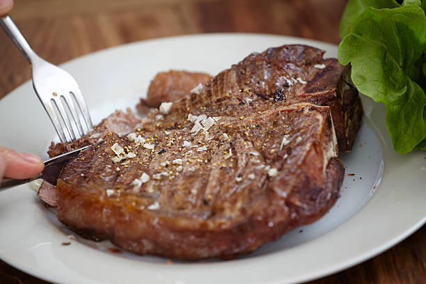 large steak on plate picture