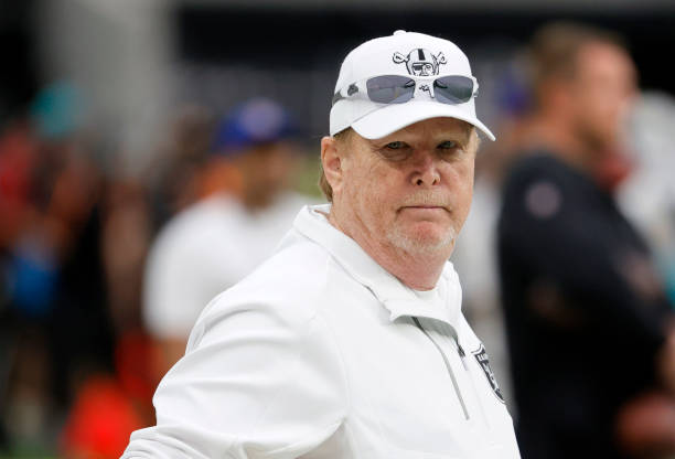 Las Vegas Raiders owner and managing general partner Mark Davis watches his team warm up before a game against the Miami Dolphins at Allegiant...