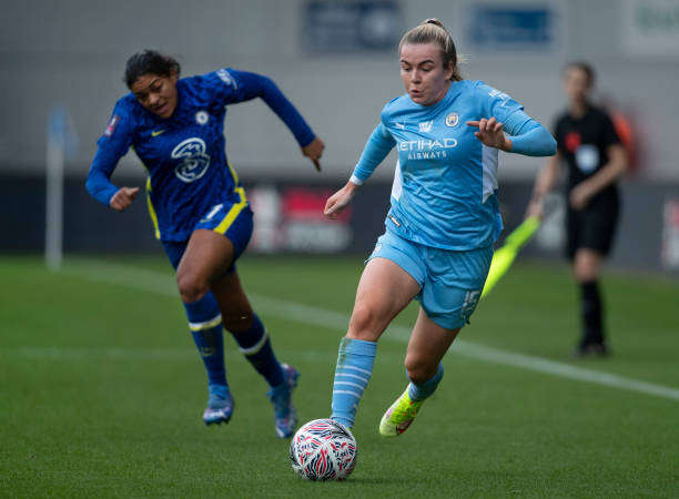 Lauren Hemp of Manchester City and Jess Carter of Chelsea in action during the Vitality Women's FA Cup Semi Final match between Manchester City and...