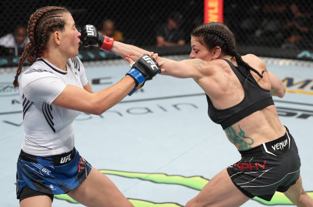 Lauren Murphy punches Miesha Tate in a flyweight fight during the UFC Fight Night event at UBS Arena on July 16, 2022 in Elmont, New York.