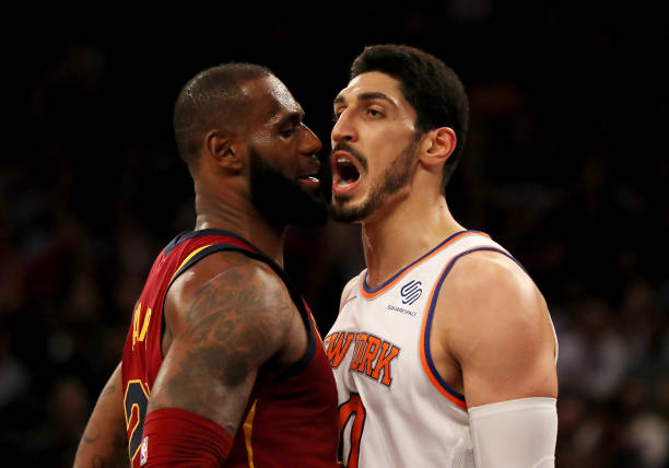 LeBron James of the Cleveland Cavaliers and Enes Kanter of the New York Knicks exchange words in the first half at Madison Square Garden on November...